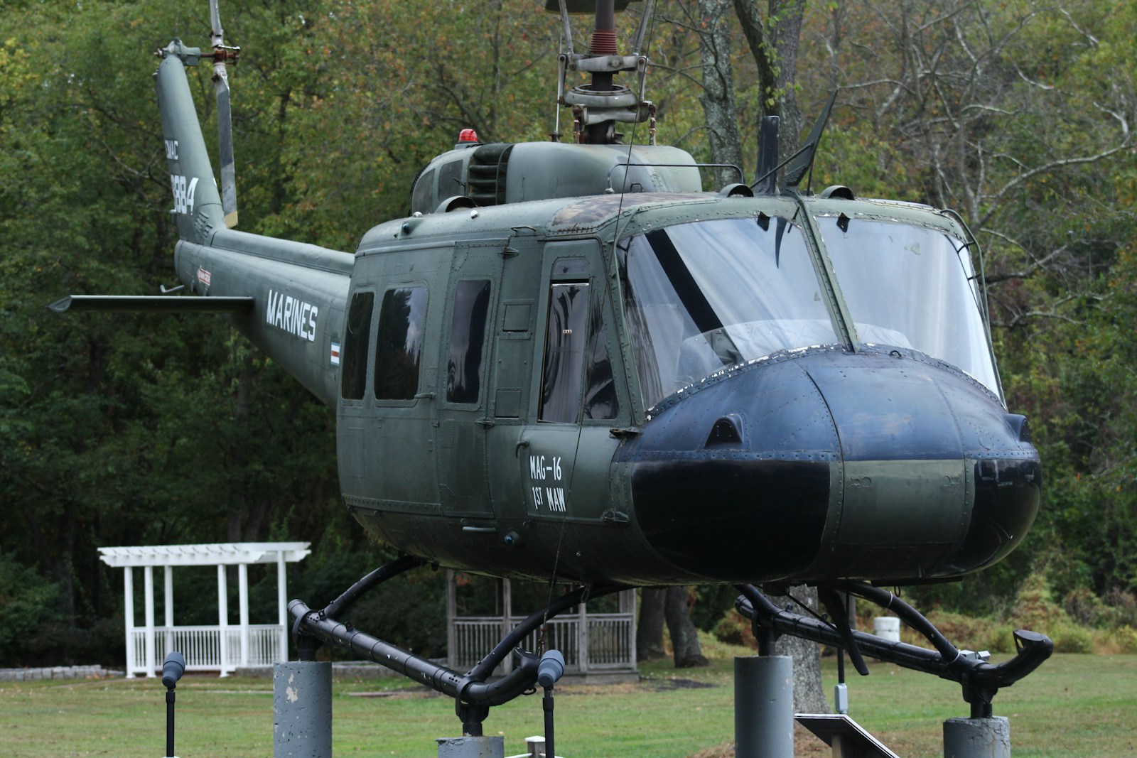 black and white helicopter on green grass field during daytime